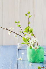 Spring blooming twigs wooden table