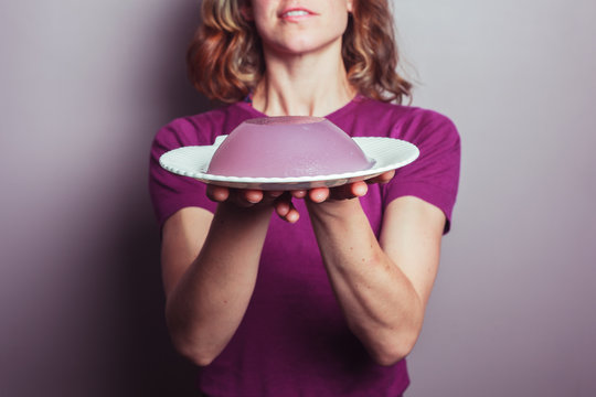 Young woman in purple serving jelly