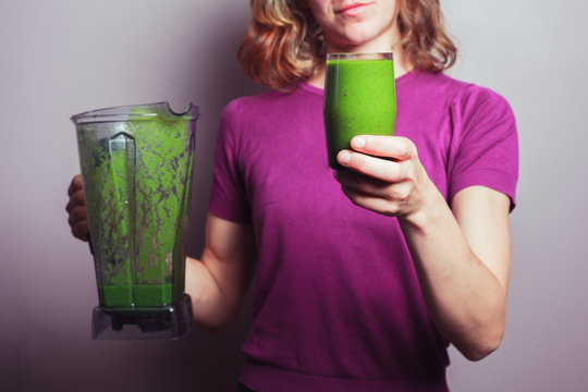 Young woman with green smoothie
