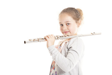 young  girl holding flute