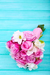 Beautiful wedding bouquet on wooden background