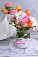 Beautiful bouquet of bright flowers in jar