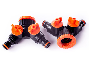 Adapter for connection of a garden hose with watering system