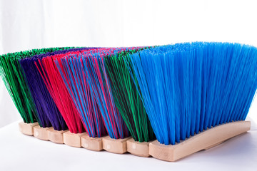 Wooden blue brush for cleaning a floor isolated on a white