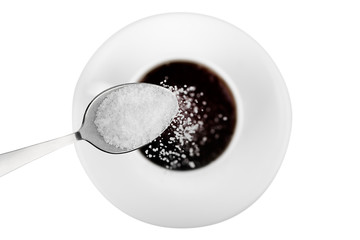Cup of coffee with  sugar on white background