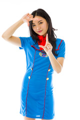 Asian air stewardess looking through finger frame