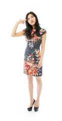 Asian young woman pointing finger to head