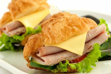 Croissant with ham and brie cheese.