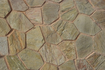 A decorative wall covered with polygonal tiles
