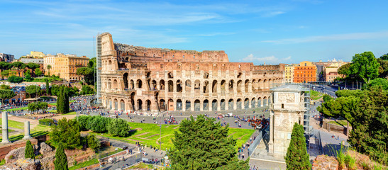 Panoramic view of Colosseum (Coliseum), Rome, Italy. City skyline in summer.