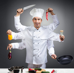 Humorous portrait of a chef with many hands
