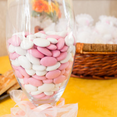 pink and white chocolate dragees on table