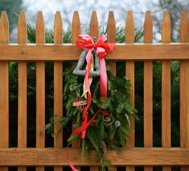 Seasonal Winter Christmas Wreath decoration on a fence