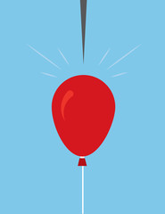 Large red balloon about to be popped by pin