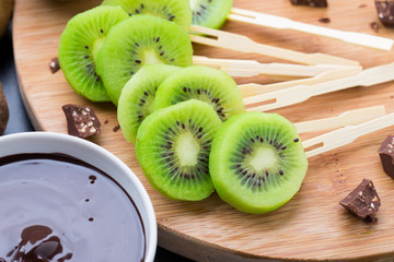 Fruits with chocolate on a stick - 65526280