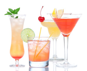 Four cocktail drinks yellow margarita cherry and tropical Martin