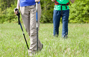 Legs of a young couple on country walk
