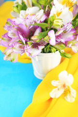Bouquet of freesias in pail on table close-up