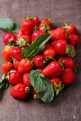 Ripe sweet strawberries  on color wooden background