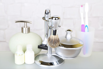 Male luxury shaving kit on shelf in bathroom