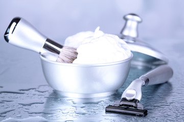 Male luxury shaving kit on table on bright background