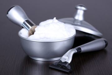 Male luxury shaving kit on wooden background