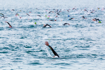 Triathletes at Ironman triathlon competition at Calella beach