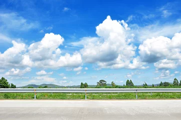 Poster Beautiful roadside view with green nature and cloudy blue sky  b © Atstock Productions