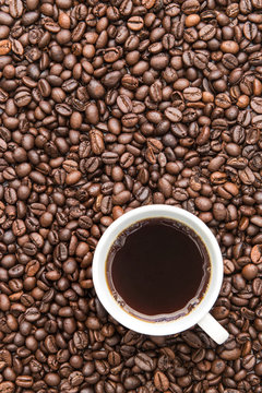 black coffee cup on coffee beans background