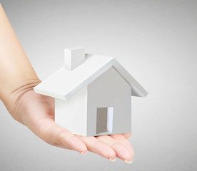 Naklejka premium holding house representing home ownership