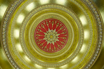 Ceilings decorated with golden light and stained glass.
