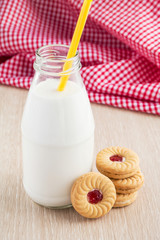 Milk bottle and strawberry jam sandwich cookies