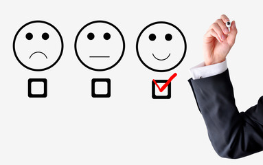 Customer satisfaction concept with businessman hand drawing smil