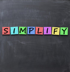Simplify things and everything concept text on blackboard with a