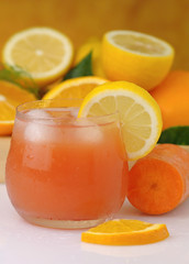 Fototapeta na wymiar Glass of cold ACE juice,orange, carrot and lemon