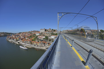 Douro river side and Porto city view with ghost train (Portugal)