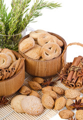 sweet sugar cookies in wooden containers with cinnamon sticks, a