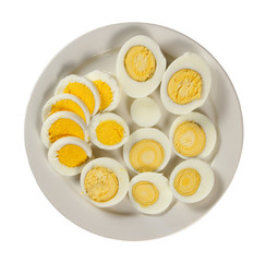 Plate with sliced eggs ( isolated on white background )