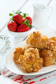 Profiteroles with nuts and strawberries