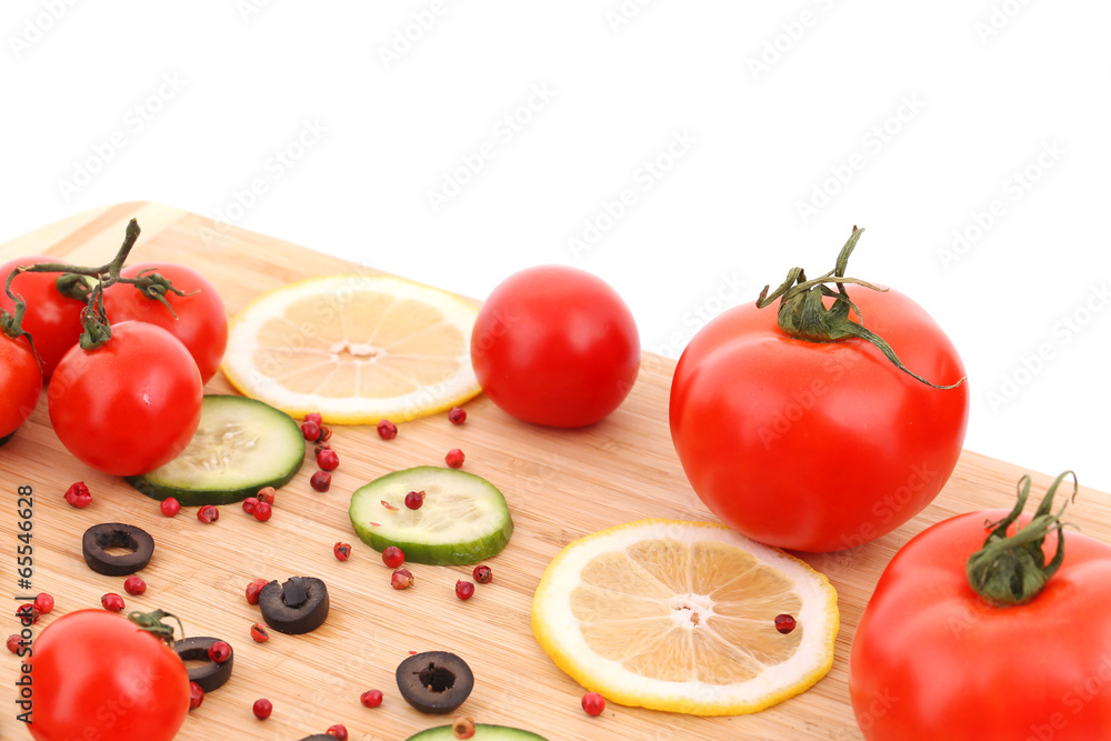 Canvas Prints Composition of vegetables on wooden platter.