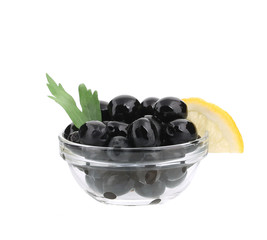 Black olives with lemon in bowl.