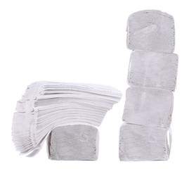 Stack of folded disposable papers.