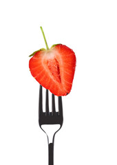 Fresh big strawberry on a fork.