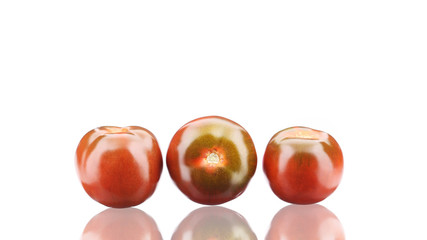 Close up of fresh three tomatoes.