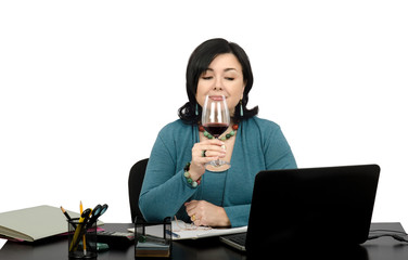 Enjoying a glass of wine while surfing on favorite websites