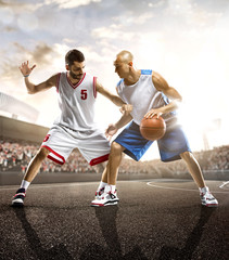 Basketball player in action on background of sky and crowd