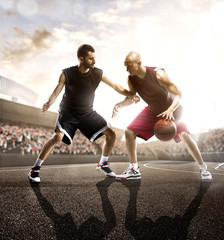 Basketball player in action on background of sky and crowd