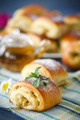 sweet apple muffins with powdered sugar and mint