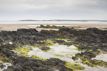 Fototapeta na wymiar Beach at low tide at Rhosneigr in Anglesey, North Wales; UK