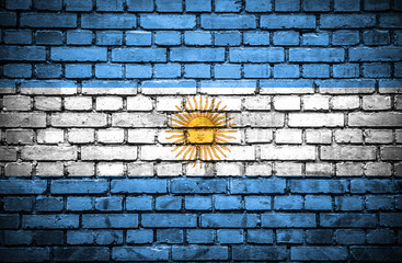 Brick wall with painted flag of Argentina